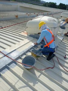 waterproofing paint application to metal roof