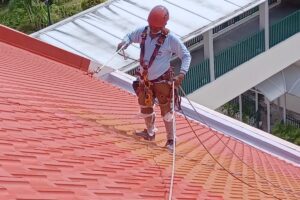 staff repairing pitched roof tiles