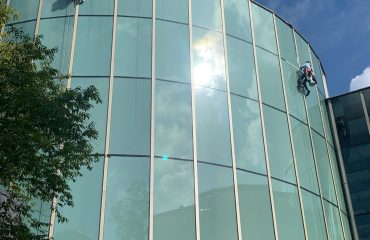 rope access waterproofing works on commercial building facade in Central Singapore by Secure Waterproofing Specialist in Singapore