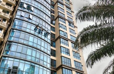 rope access team performing waterproofing works on commercial building in West Singapore
